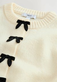 Unselected, ecru bows