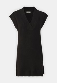 Abito collo V senza maniche di colore nero, con bordi a coste, spacchi laterali e una trama morbida. Design semplice adatto da sovrapporre.
