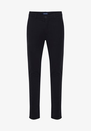 Pantalons noirs ajustés en tissu doux. Comprend des poches avant, des passants de ceinture et une fermeture éclair avec bouton.