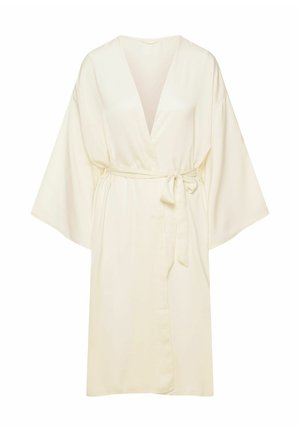 Jasno-beżowy kimono, wykonany z gładkiego materiału. Posiada szerokie rękawy, dekolt w kształcie V oraz przewiązywany pasek w talii, umożliwiający regulację dopasowania.