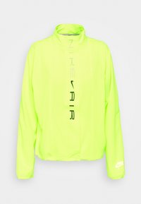 Giacca leggera di un luminoso giallo neon con colletto alto. Presenta la scritta nera "NIKE AIR" sul davanti e un logo sulla manica.