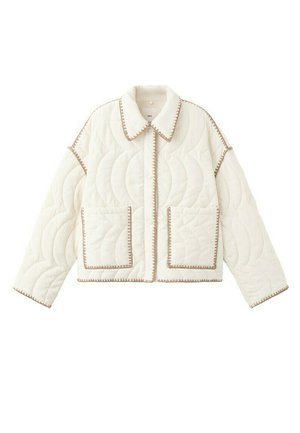 Veste matelassée blanche avec coutures courbes, deux poches avant, un col pointu et une bordure beige le long des bords et des coutures.