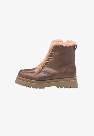 Bruine leren enkellaarsjes met een pluizige tan kraag, met een vetersluiting en een gestructureerde rubberen zool voor grip.