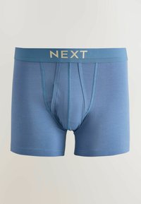 Siniset miesten bokserit, joissa on etutasku ja kirjailtu koristelu, leveällä vyötärönauhalla, jossa on beigenväriset "NEXT"-kirjaimet.