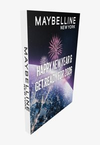 Produit Maybelline New York avec un couvercle noir et violet, présentant des feux d'artifice et le texte : "Bonne année et préparez-vous pour 2026."