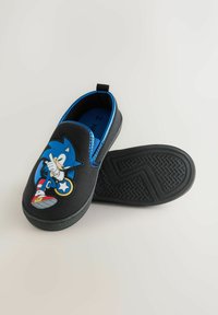 Children’s black slip-on shoes with blue lining featuring a colorful Sonic the Hedgehog character on the front, one shoe sole visible.