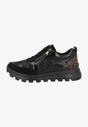 Black sneakers with mixed materials, including shiny patent leather, suede, and textured accents, featuring a chunky sole and zipper detail.