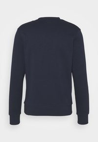 Mörkblå sweatshirt med rund halsringning, långa ärmar och ribbade mudd. Tillverkad av ett mjukt, medeltungt material med ett enfärgat mönster.