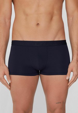 Dunkelblaue Boxershorts mit glatter Textur, elastischem Bund mit erhabenem Logo und körperbetontem Design.