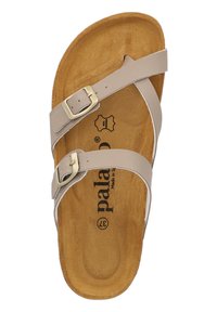 Beige sandal featuring two adjustable straps with metallic buckles, a contoured brown insole, and a smooth textured outsole.
