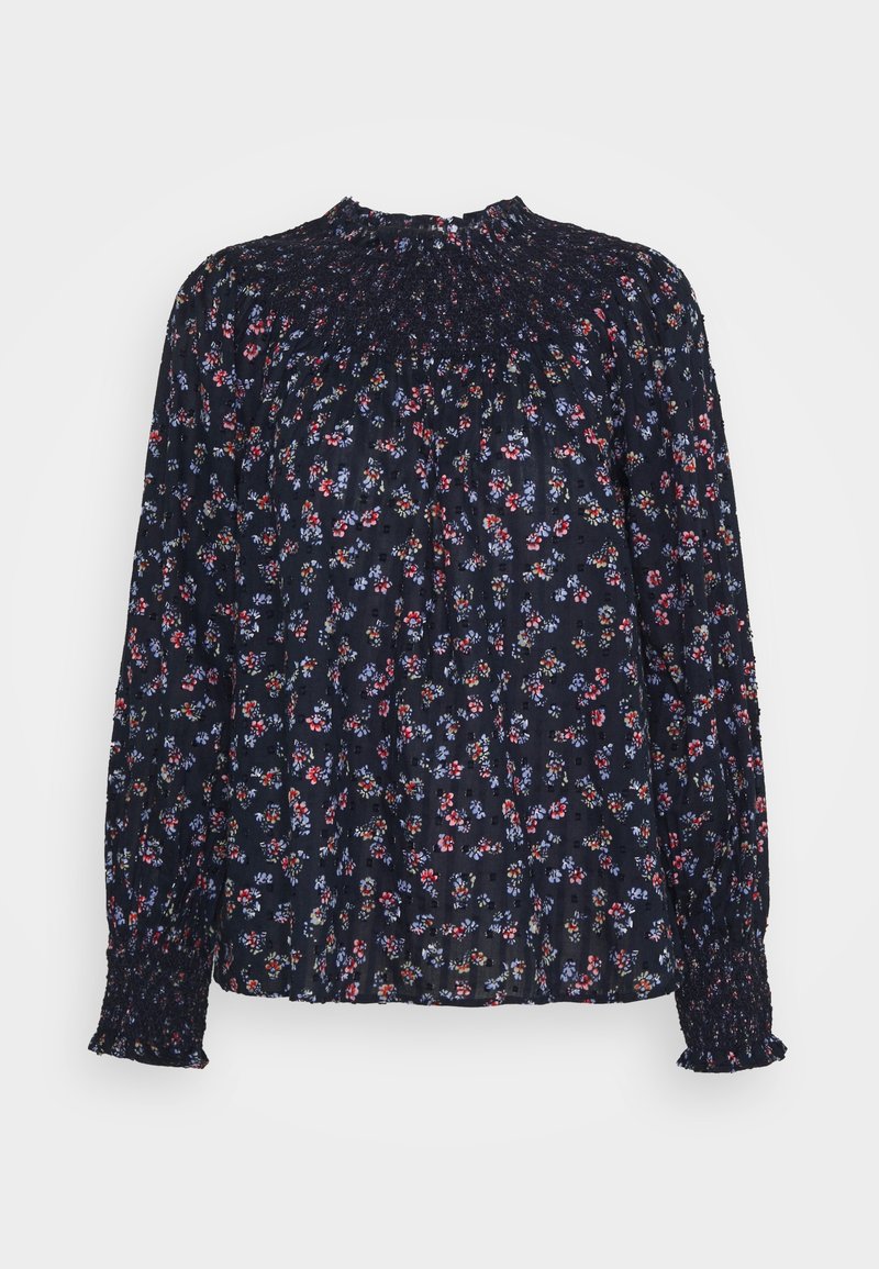 Blouse bleu foncé à manches longues avec un petit imprimé floral rouge, violet et blanc, col montant smocké et poignets, coupe ample.