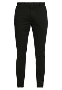 Chinos neri slim-fit realizzati in tessuto di cotone. Presentano una chiusura con zip, bottone e quattro tasche con una texture liscia e opaca.