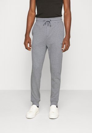 Graue Baumwoll-Jogginghosen mit einem elastischen Bund und verstellbarem Kordelzug. Rippbündchen und ein kleines Logo-Highlight am Bein.