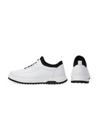 White leather sneakers with black accents, rubber sole, round toe, and lace-up design. Features a smooth finish and contrasting heel tab.