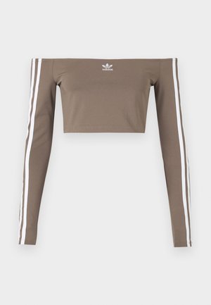 Brown off-the-shoulder crop top made of smooth fabric, featuring long sleeves with white stripes along each arm and a small logo on the chest.