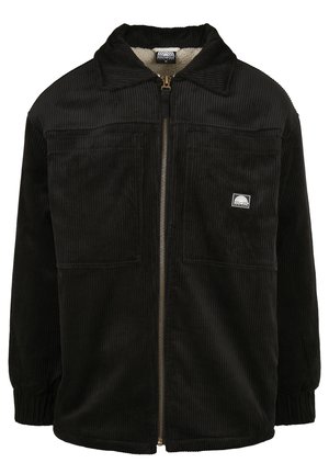 Giacca in corduroy nera con zip frontale, colletto a punta, due tasche frontali e un rivestimento morbido. Presenta una texture a coste e polsini elasticizzati.