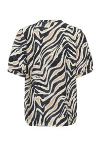 Chemise à manches courtes avec un motif de rayures ondulées abstraites noir, beige et blanc, sur un tissu doux.