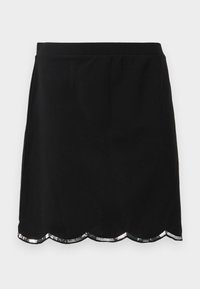 Jupe noire mi-longue avec un ourlet festonné orné de paillettes argentées, en tissu lisse et avec une taille ajustée.
