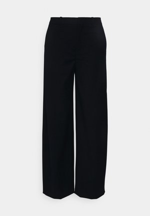 Pantalons larges noirs en tissu lisse, dotés d'une taille haute et sans poches ni embellissements visibles.