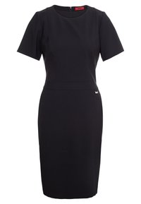 Robe noire ajustée à manches courtes, encolure ronde, fermeture éclair au dos et détails de couture subtils. Dispose d'une petite étiquette logo à la taille.