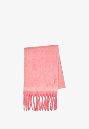 Miękki różowy wełniany szal z frędzlami na końcach, starannie złożony, z subtelnym napisem marki przy jednym brzegu.