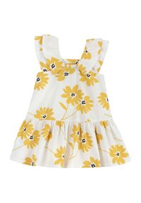 Vestido floral de tela blanca con flores amarillas y centros negros. Tirantes con volantes y cintura fruncida con falda acampanada.