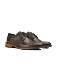 Brown leather dress shoes with brogue detailing, rounded toe, flat laces, and wooden sole. The texture is smooth with a polished finish.