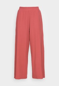 Pantalon à jambes larges de couleur rose poussiére, fabriqué en tissu léger à surface texturée et doté d'une taille haute élastique.