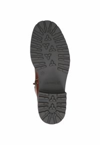 Semelle en caoutchouc marron avec un motif de grip texturé, comportant un logo et une indication de taille. La semelle a une forme arrondie et une conception durable.