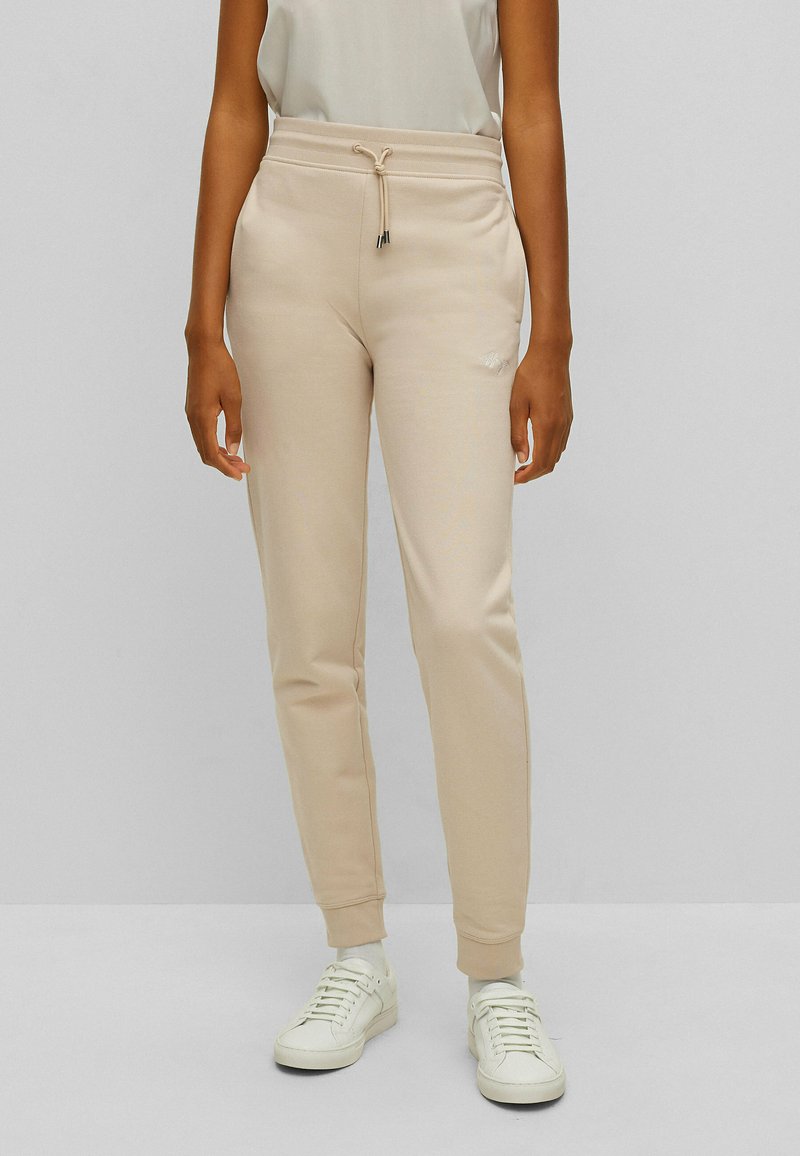 HUGO EASY Tracksuit bottoms light beige one/beige Zalando