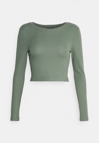 Grünes, geripptes Langarm-Crop-Top mit Rundhalsausschnitt und figurbetontem Design. Hergestellt aus weichem, dehnbarem Material mit sichtbarem Rippenmuster.