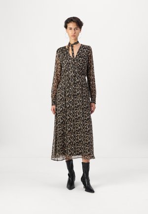 Black, long-sleeve dress with a floral pattern, cinched waist, V-neck, and a tie detail at the collar. Sheer fabric and ankle-length design.