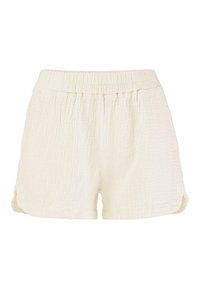 Krämfärgade shorts i texturerad framtill, med elastisk midja och uppvikta detaljer för en avslappnad passform.