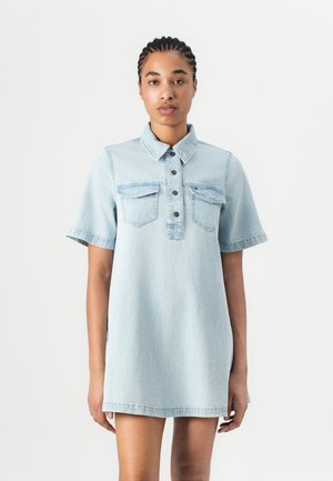 Light blue denim dress with a collar, short sleeves, front button closure, and two chest pockets. Features a relaxed fit and straight hem.