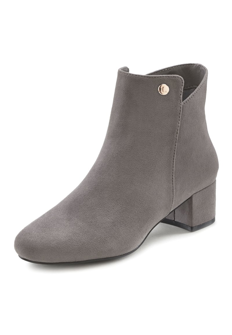 Grey suede ankle boot with a rounded toe, low block heel, and gold accent button detail on the side. Smooth texture and fitted design.