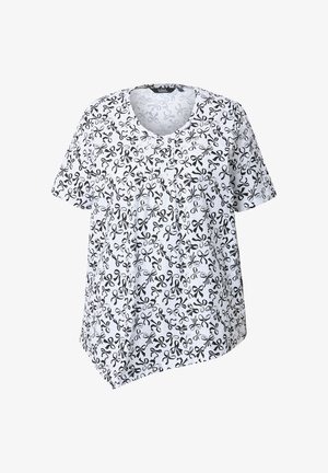 T-shirt blanc à manches courtes avec un motif de ciseaux noirs, un décolleté arrondi et un ourlet asymétrique. Tissu doux et léger.