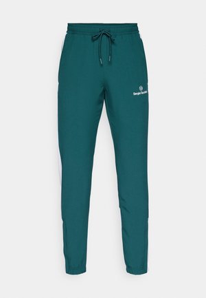 Teal athletic pants with an elastic waistband, drawstring, and white side stripes. Features the "Sergio Tacchini" logo on the front.