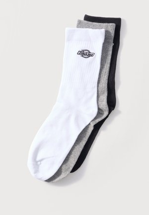 Kolm paari meeskonnatüki sokke valges, hallis ja mustas värvitoonis, valgete paaride mansetil väike logo.