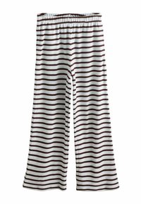 Pantalon ample avec taille élastique, comportant des rayures horizontales brunes et blanches sur tout le tissu.