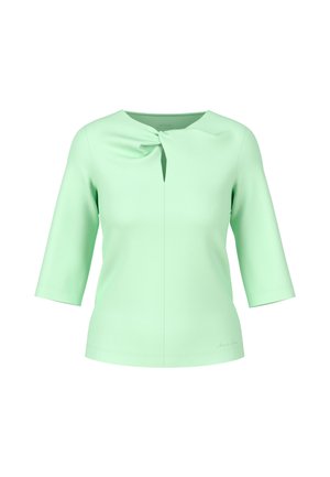 Light green, short-sleeve top with a keyhole neck design and a side knot detail. Smooth texture, fitted silhouette, and plain fabric.