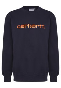 Sudadera azul marino hecha de algodón, con un logo bordado en naranja que dice "carhartt" en el frente, y con puños y dobladillo de canalé.