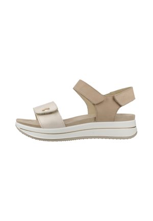 Sandalo beige e bianco con punta aperta, cinturini regolabili, suola imbottita e platform bassa, progettato per il comfort e l'uso casual.