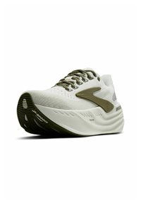 White athletic shoe featuring a textured upper, olive green accents, a cushioned sole with grooves, and a prominent Brooks logo on the side.