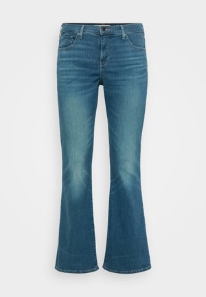 Blaue Jeans im Schlagstil mit mittlerer Bundhöhe, fünf Taschen-Design und leichtem Ausbleichen an den Oberschenkeln. Mit sichtbaren Nahtdetails.