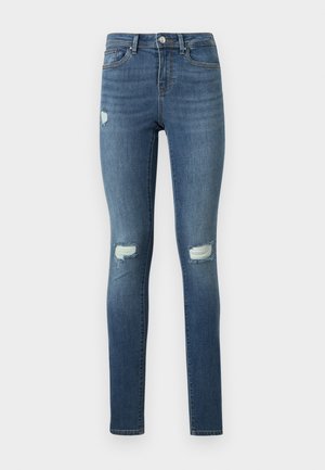 Blaue Skinny-Jeans mit verwaschenen Details und ausgefransten Rissen an Oberschenkeln und Knien, versehen mit Fronttaschen und einem Knopfverschluss.