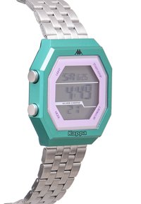 Digital klocka med ett oktagonalt teal-färgat hölje, ljuslila display, silverfärgad metallarmband och knappar på sidan för funktionalitet.