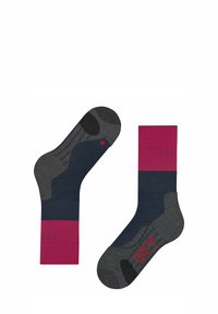 Chaussettes à rayures grises et roses avec texture côtelée, bouts et talons renforcés. Présentent un détail de logo à la cheville et un design de soutien de la voûte plantaire.