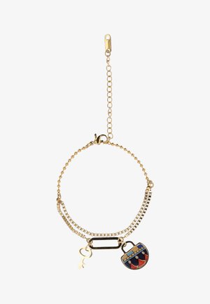 Złota bransoletka z łańcuszka z małym złotym kluczykiem oraz kolorową zawieszką w kształcie torebki z wzorem, posiadająca regulowane zapięcie.