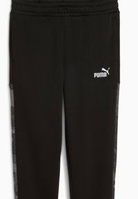 Pantalones de chándal negros con cinturilla elástica, que presentan paneles laterales con un patrón gris y un logo de Puma blanco en la parte frontal.