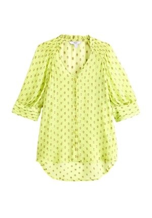Blouse vert clair à pois dorés, col en V, boutons devant, manches 3/4 et coupe décontractée et ample.